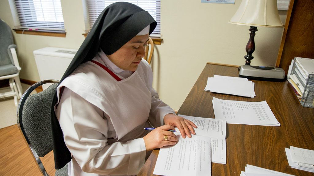 Sister reading papers