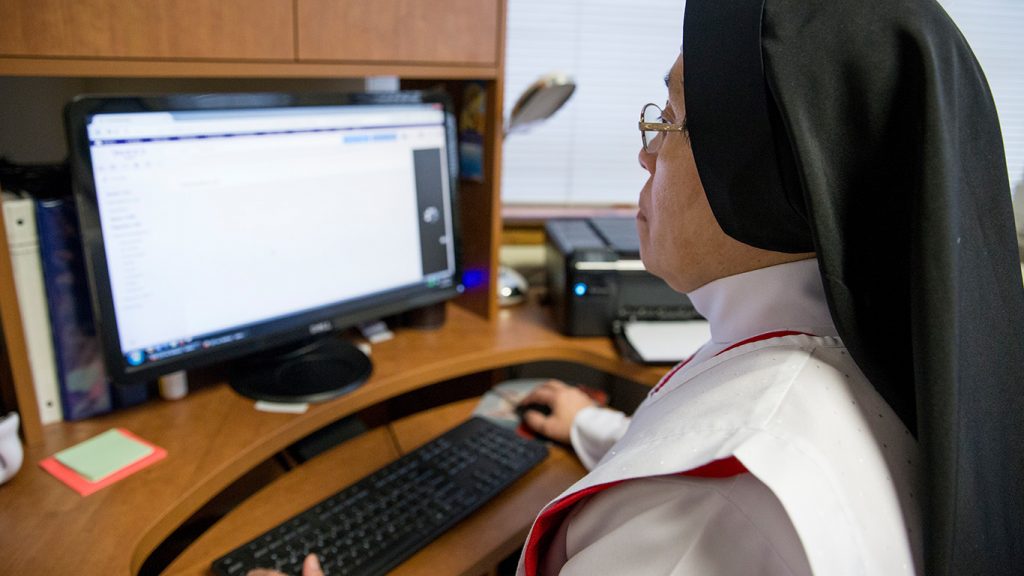 Sister working at a computer