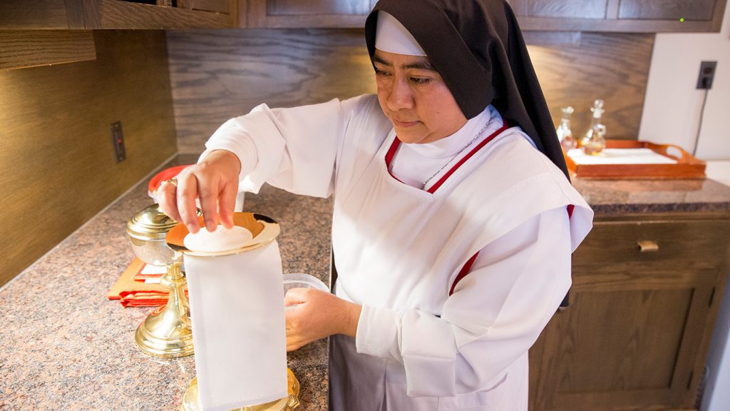 Sister working in the sacristy