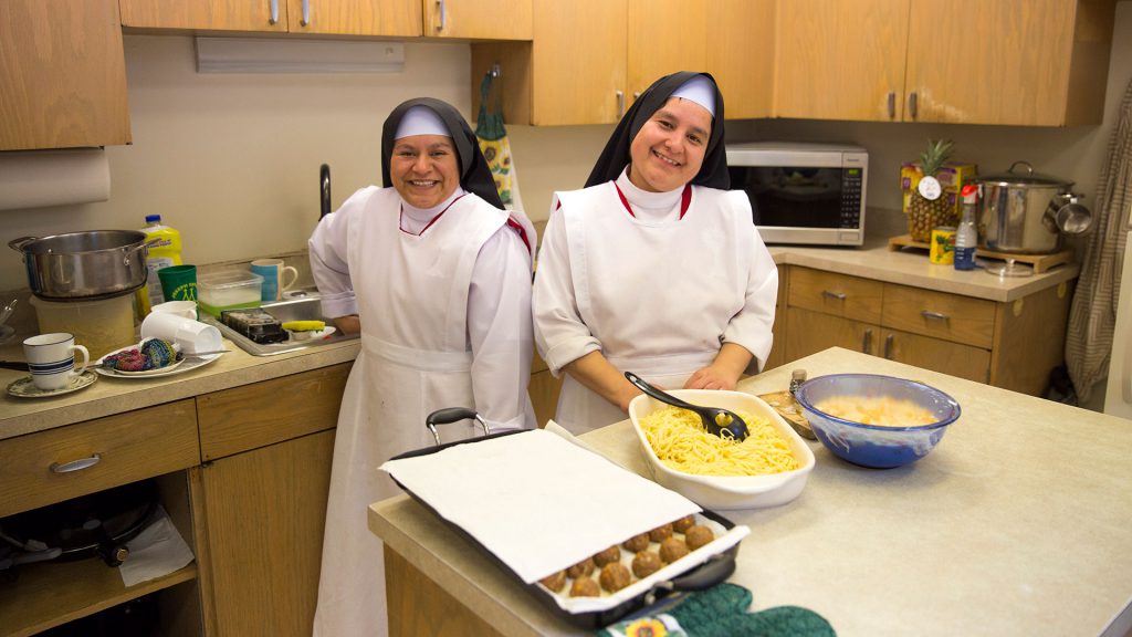 Two sisters cooking food